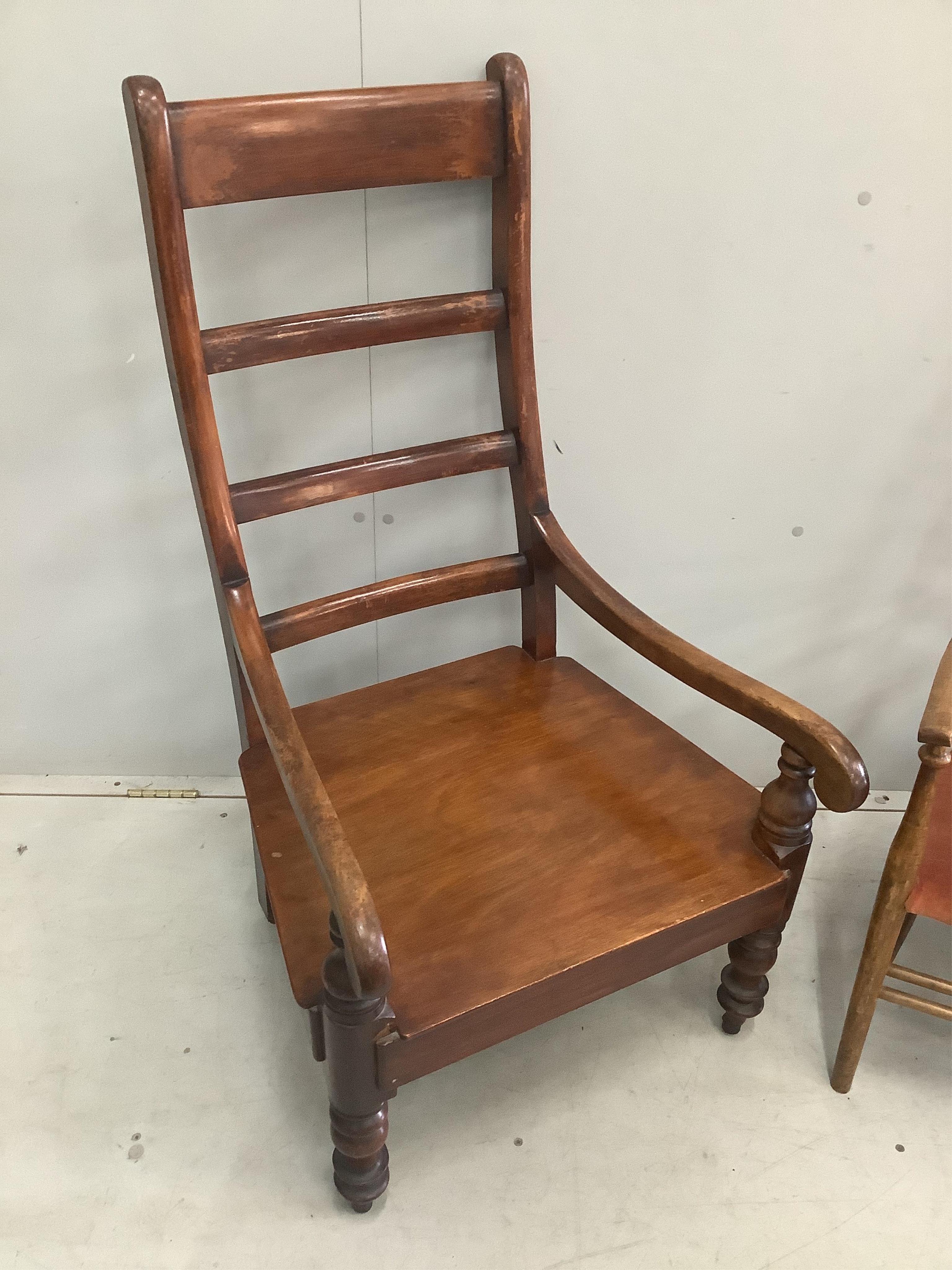 A Victorian Provincial mahogany ladderback armchair, height 107cm, together with an Arts & Crafts mahogany ladderback chair